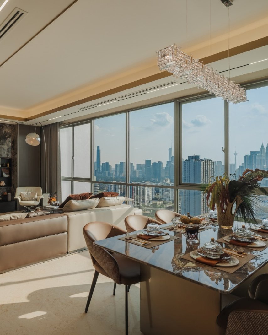 Show unit living and dining room with a view of the Kuala Lumpur skyline